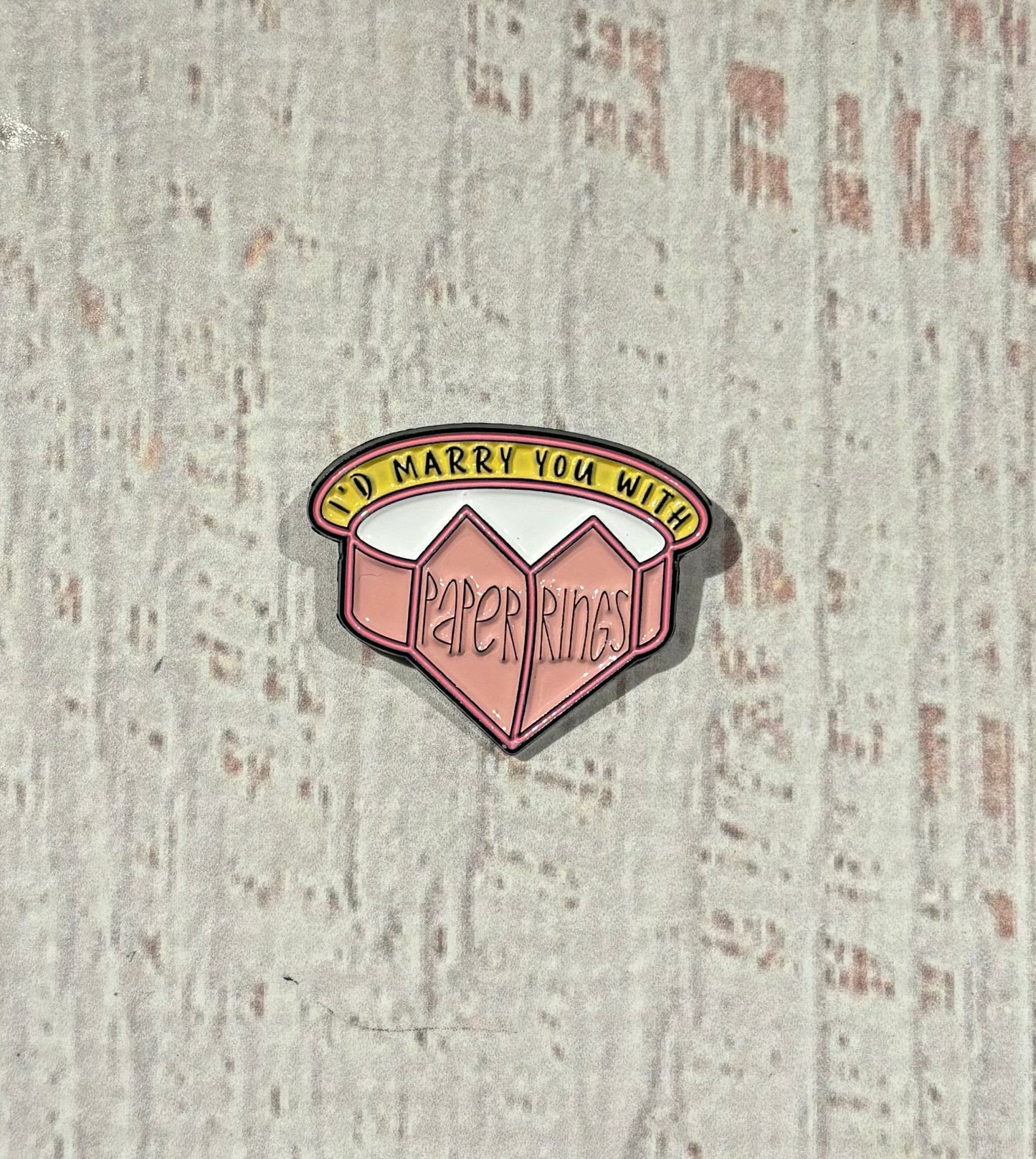 Paper Rings Enamel Pin